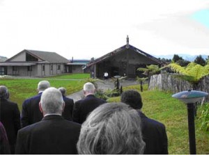 Visitors march in procession to the caller at the entrance to the meeting house 